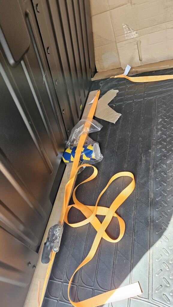 Small parcel securely strapped down for same-day courier delivery